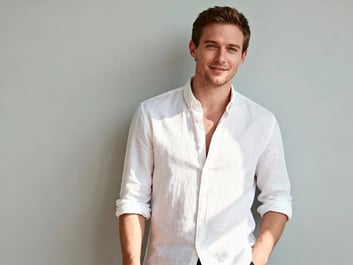 The man rips off his shirt, revealing a ripped, muscular physique.in Image to Video